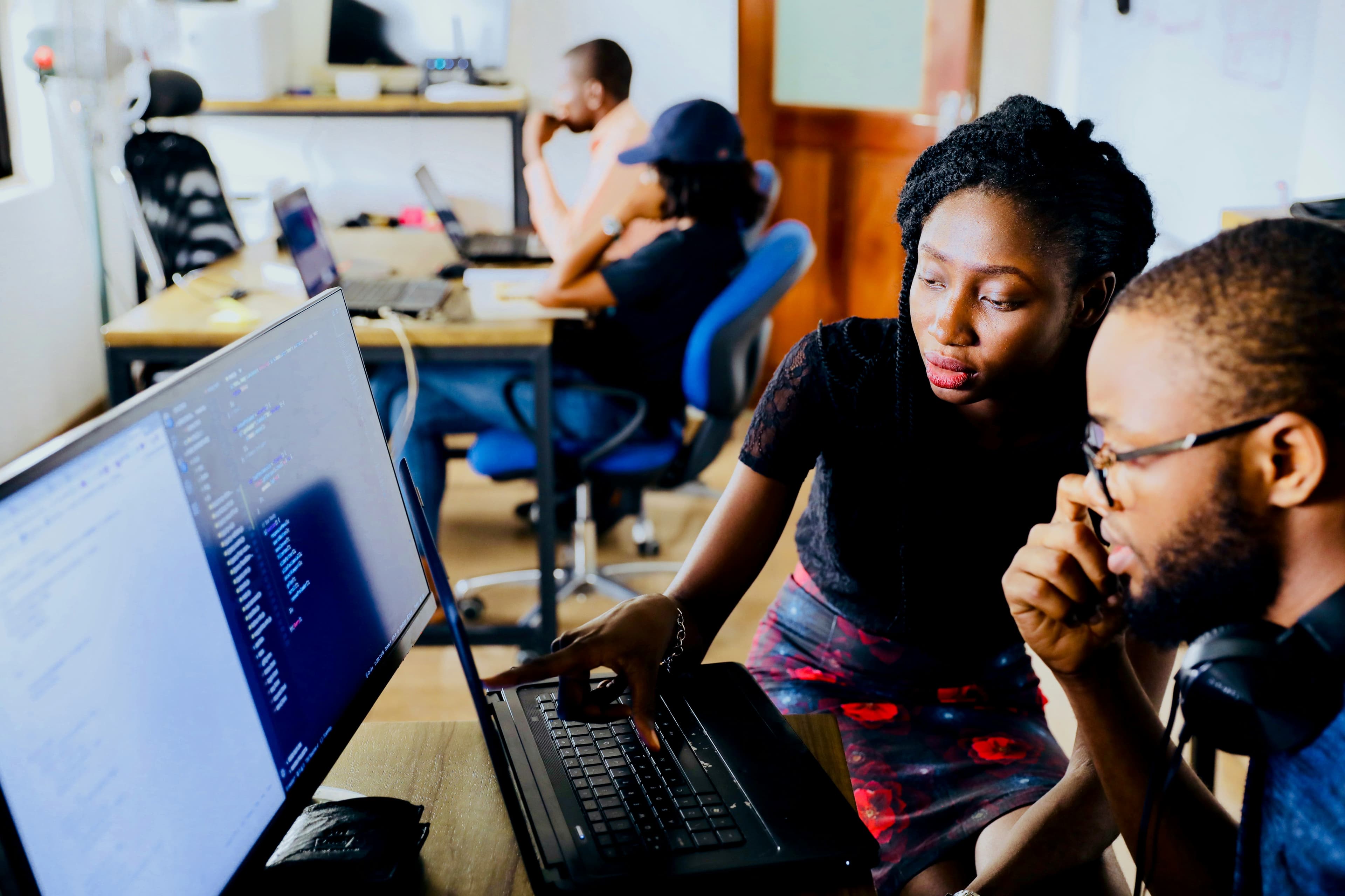 Diverse Group of Young Technical Builders Reviewing Code Architectures and Project Pipelines